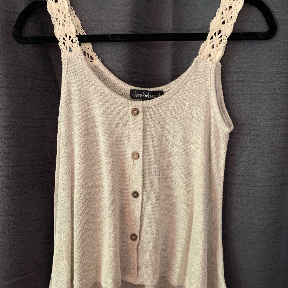Tank top with detailed straps. Buttons down front